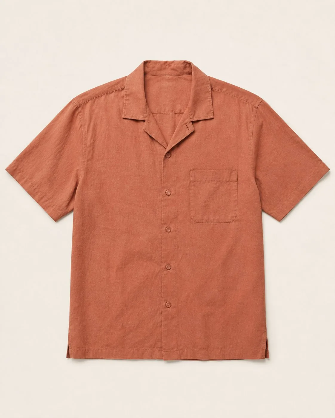 The shirt's supplier photo: a rust camp-collar shirt laid flat on a cream background